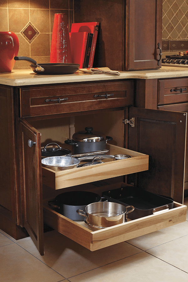 neatly stored pans in cabinet