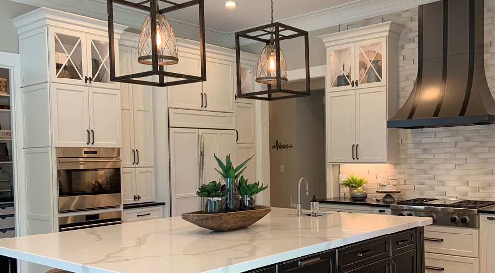 modern white kitchen with black cabinets